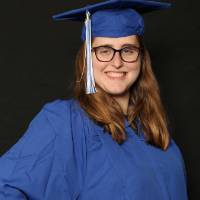 gvsu soon to be graduate with hand on hip for picture